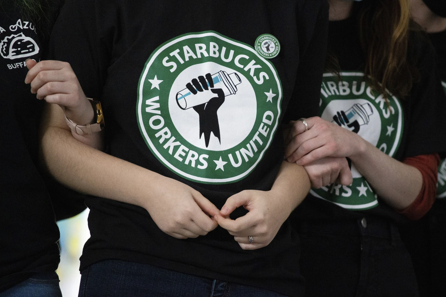 Workers at 200 Starbucks stores walk off job on busy Red Cup Day to protest labour practices