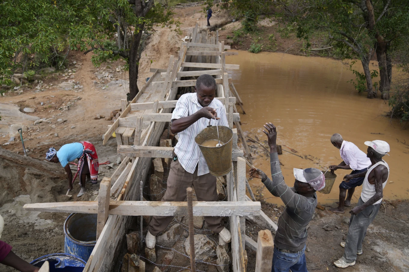 Water: Kenyans in semi-arid regions turn to sand dams on seasonal rivers to trap surface runoff
