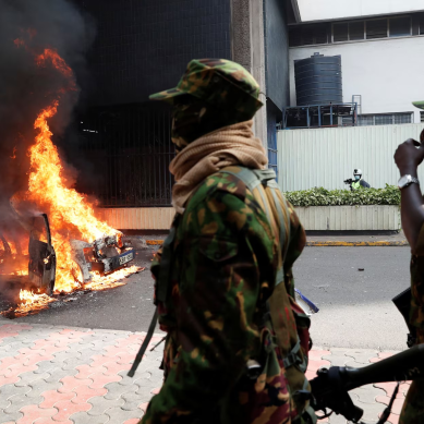 Vehicles burnt in protests as pressure piles on senior police to quit over death of blogger