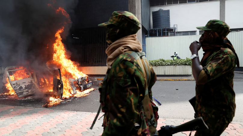 Vehicles burnt in protests as pressure piles on senior police to quit over death of blogger