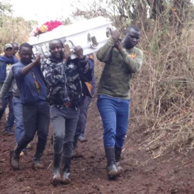 Mourners in central Kenya carry casket on shoulders after heavy rains render road impassable