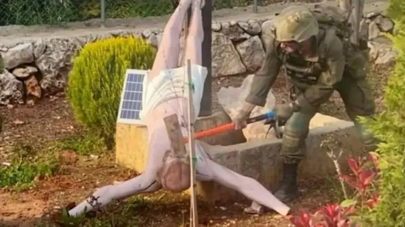 Israeli soldier kicks up worldwide storm after knocking down Jesus Christ statue in Lebanon with sledgehammer